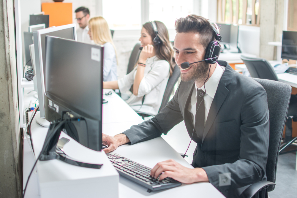 man in suit doing phone sales
