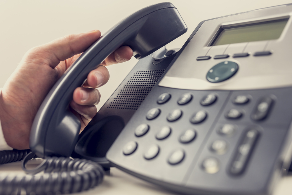 businessman-answering-a-voip-phone